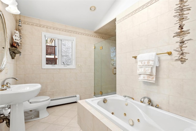 full bathroom with tile walls, tiled shower, a baseboard heating unit, and a jetted tub
