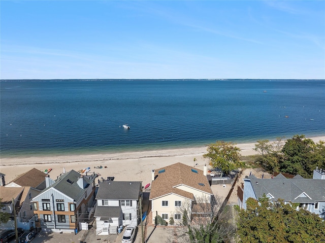 water view featuring a residential view and a view of the beach