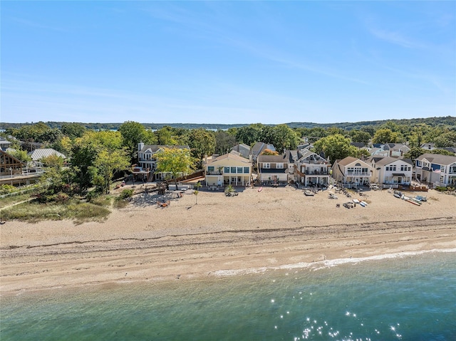 drone / aerial view featuring a residential view and a water view