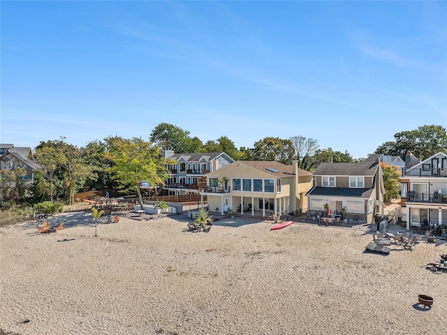 rear view of property with a patio area and a residential view