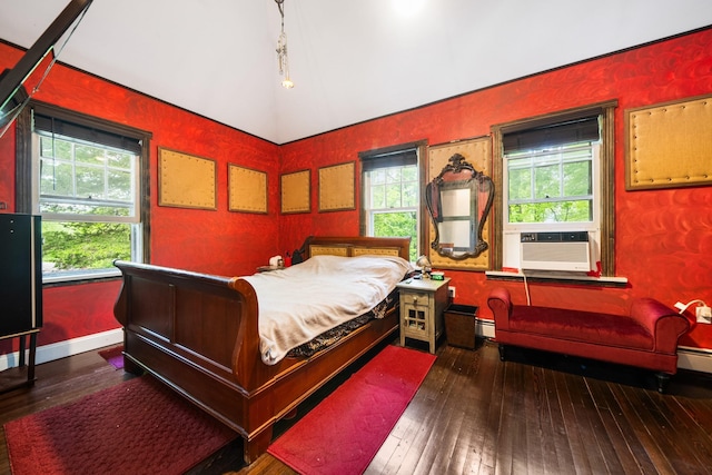 bedroom with hardwood / wood-style floors, cooling unit, baseboards, and lofted ceiling
