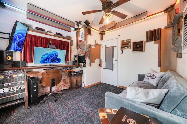 living room with carpet flooring, a ceiling fan, and baseboards