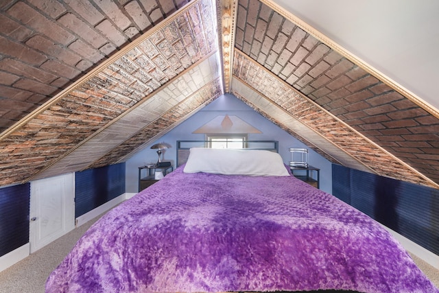 carpeted bedroom featuring lofted ceiling
