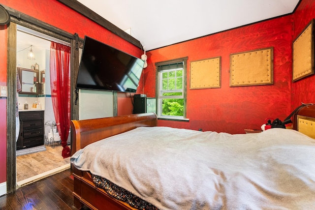 bedroom featuring wood finished floors