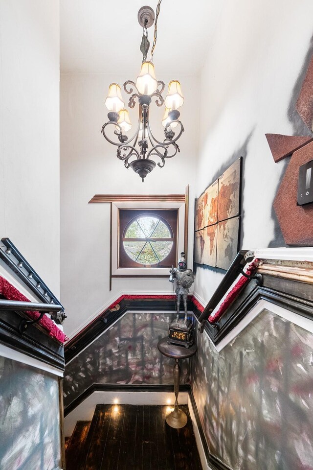 foyer entrance with a chandelier