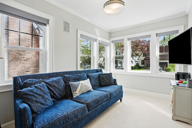 living area with carpet flooring, baseboards, and plenty of natural light