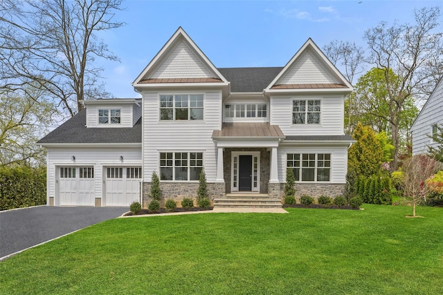 20 Carthage Ln, Scarsdale, NY 10583 - view of front of house featuring driveway, stone siding, a front lawn, roof with shingles, and a standing seam roof