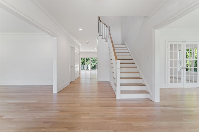 20 Carthage Ln, Scarsdale, NY 10583 - stairs with french doors, wood finished floors, baseboards, recessed lighting, and ornamental molding