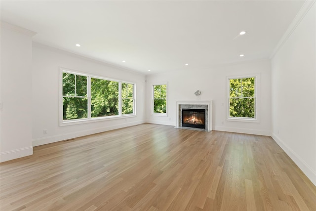 20 Carthage Ln, Scarsdale, NY 10583 - unfurnished living room with ornamental molding, baseboards, light wood-style floors, a high end fireplace, and recessed lighting