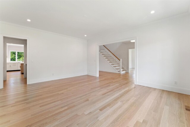 20 Carthage Ln, Scarsdale, NY 10583 - spare room with stairway, crown molding, light wood-style floors, baseboards, and recessed lighting
