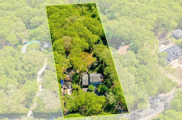 view of property location with property parcel outlined and a forest