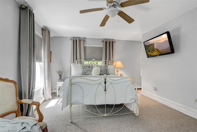 bedroom with carpet floors, a ceiling fan, and baseboards