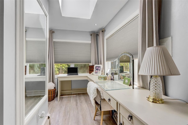 home office with light wood finished floors and plenty of natural light