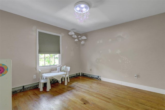dining area with wood finished floors and baseboards
