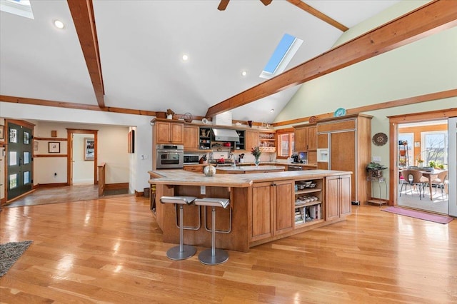 58 Big Island Rd, Warwick, NY 10990 - kitchen featuring open shelves, oven, light countertops, beamed ceiling, and wall chimney exhaust hood