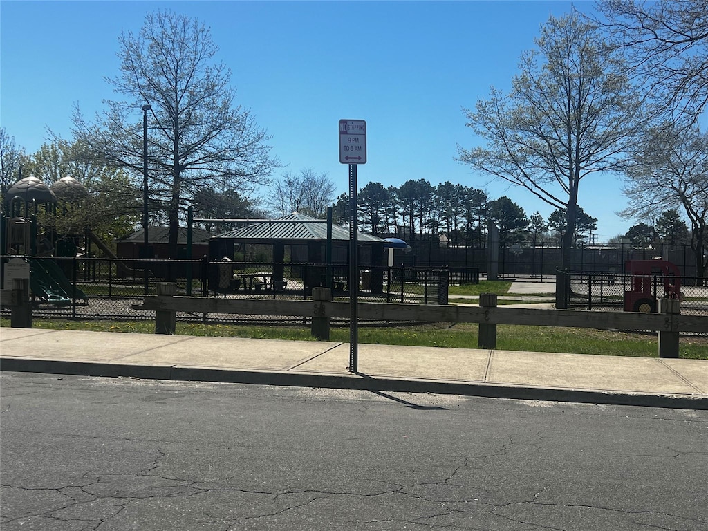 view of community with fence and playground community