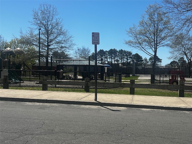 view of community with fence and playground community