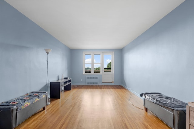 325 King St Unit 4D, Port Chester, NY 10573 - living room with radiator heating unit and wood finished floors