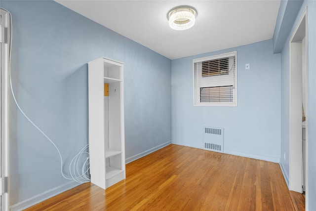 325 King St Unit 4D, Port Chester, NY 10573 - unfurnished bedroom with wood-type flooring and baseboards