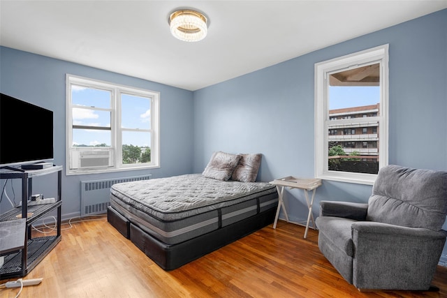 325 King St Unit 4D, Port Chester, NY 10573 - bedroom featuring radiator and light wood-style flooring