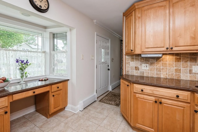 32 Peony Rd, Levittown, NY 11756 - kitchen featuring light tile patterned floors, backsplash, dark stone countertops, baseboards, and a desk