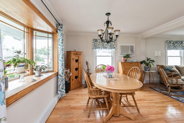 32 Peony Rd, Levittown, NY 11756 - dining space with light wood finished floors, baseboards, a chandelier, an AC wall unit, and crown molding