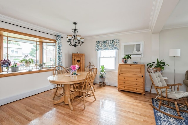 32 Peony Rd, Levittown, NY 11756 - dining area featuring a chandelier, ornamental molding, an AC wall unit, light wood-style floors, and baseboards