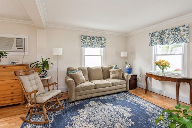32 Peony Rd, Levittown, NY 11756 - living room featuring plenty of natural light, an AC wall unit, wood finished floors, and crown molding