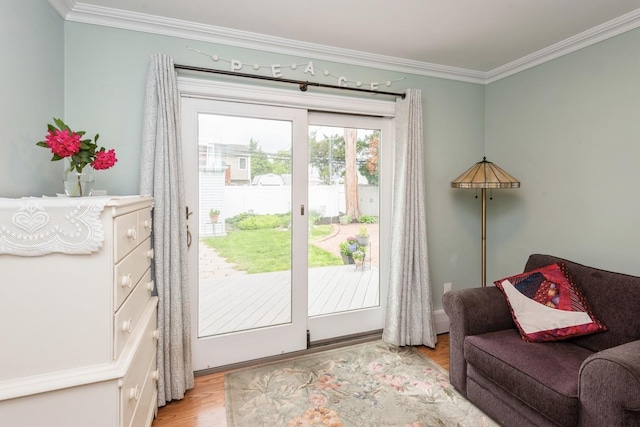 32 Peony Rd, Levittown, NY 11756 - doorway featuring light wood-style floors and ornamental molding
