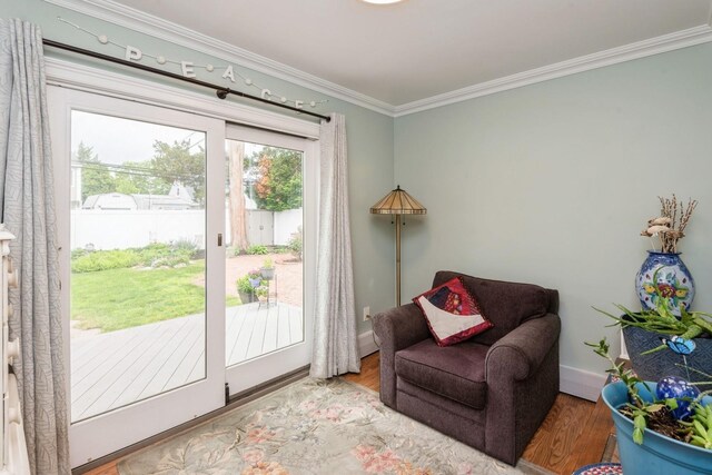 32 Peony Rd, Levittown, NY 11756 - sitting room featuring crown molding, wood finished floors, and baseboards