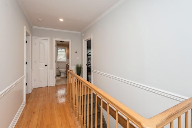 32 Peony Rd, Levittown, NY 11756 - corridor with light wood-style flooring, an upstairs landing, ornamental molding, and recessed lighting