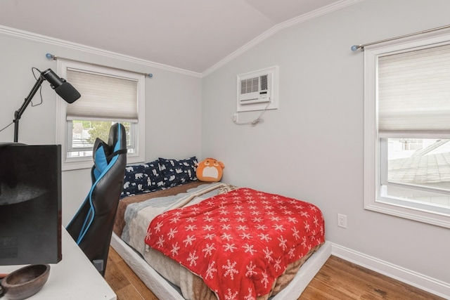 32 Peony Rd, Levittown, NY 11756 - bedroom with wood finished floors, crown molding, an AC wall unit, lofted ceiling, and baseboards