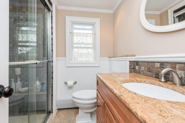 32 Peony Rd, Levittown, NY 11756 - full bathroom with vanity, a shower stall, wainscoting, toilet, and ornamental molding