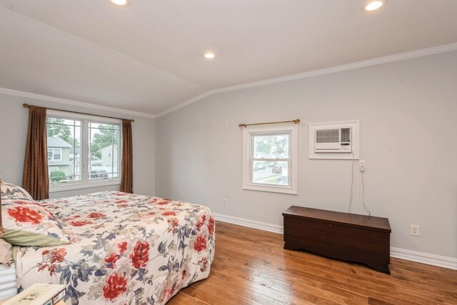 32 Peony Rd, Levittown, NY 11756 - bedroom featuring crown molding, baseboards, lofted ceiling, wood finished floors, and a wall mounted AC