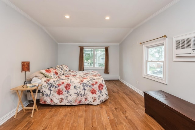 32 Peony Rd, Levittown, NY 11756 - bedroom featuring wood finished floors, lofted ceiling, baseboards, ornamental molding, and a wall unit AC
