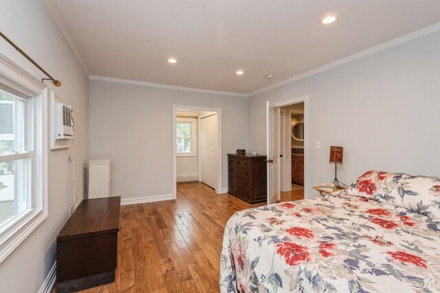 32 Peony Rd, Levittown, NY 11756 - bedroom with light wood finished floors, ornamental molding, recessed lighting, and baseboards
