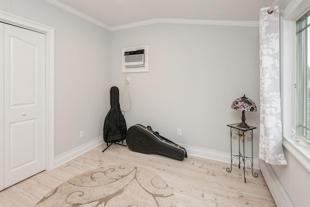 32 Peony Rd, Levittown, NY 11756 - unfurnished room featuring a wall unit AC, ornamental molding, wood finished floors, and baseboards