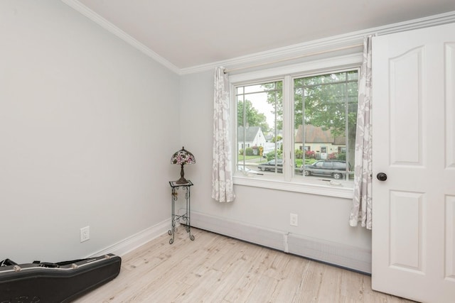 32 Peony Rd, Levittown, NY 11756 - empty room with wood finished floors, baseboards, and ornamental molding