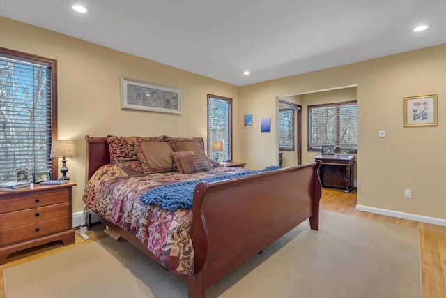bedroom featuring baseboards, recessed lighting, and light wood finished floors