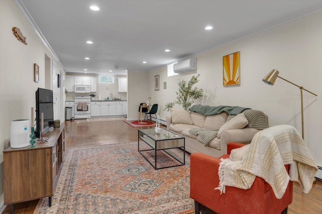 living room with recessed lighting, crown molding, a wall mounted AC, and wood finished floors