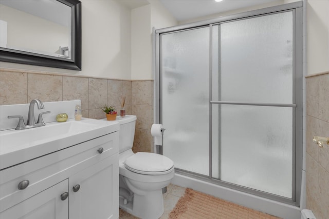 bathroom featuring tile walls, a stall shower, and toilet