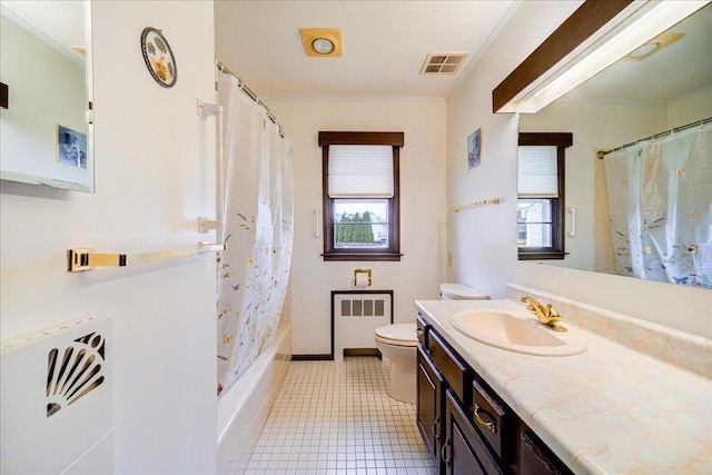 bathroom featuring toilet, visible vents, a healthy amount of sunlight, and radiator