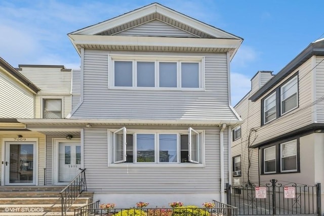 view of front facade with a fenced front yard and entry steps