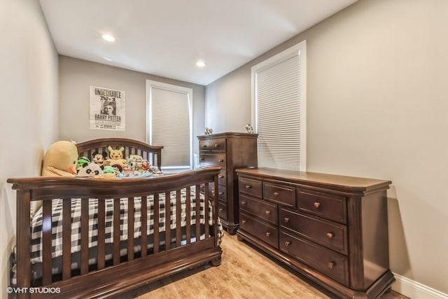 bedroom featuring recessed lighting and light wood-style flooring
