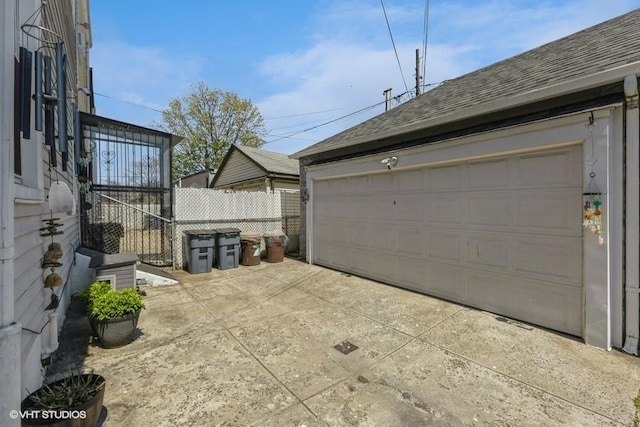 garage with fence