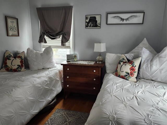 bedroom featuring dark wood-type flooring