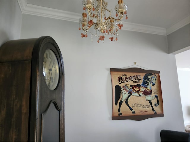 room details featuring a notable chandelier and ornamental molding