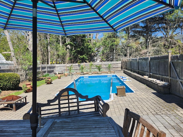2575 Oaklawn Ave, Southold, NY 11971 - view of swimming pool with a fire pit, a fenced backyard, and a deck