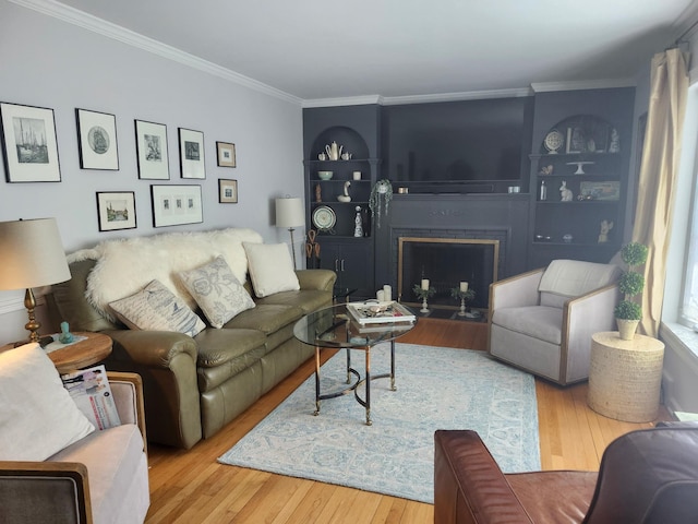 2575 Oaklawn Ave, Southold, NY 11971 - living room with a fireplace with flush hearth, crown molding, and wood finished floors