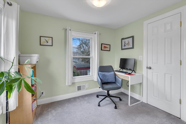 office featuring visible vents, carpet flooring, and baseboards